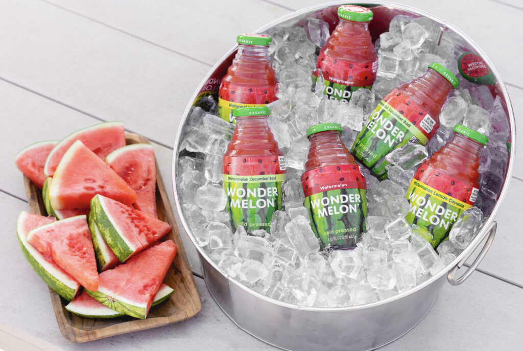 Wonder Melon 100% organic cold-pressed juice bucket and ice image