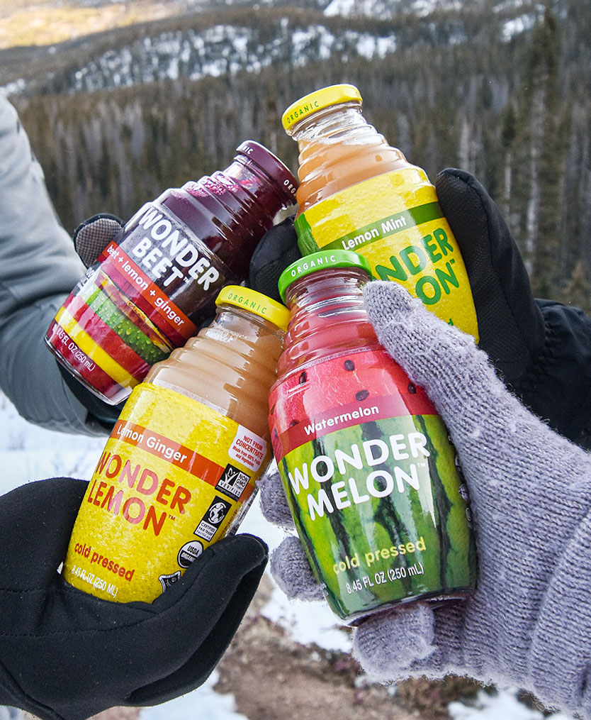 Wonder Juice four products with hands image