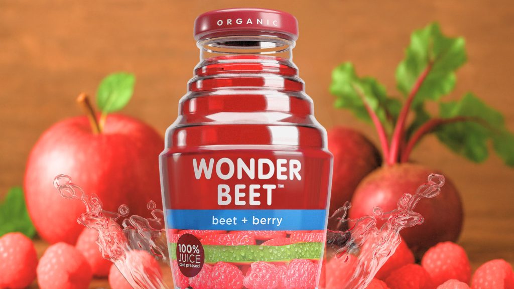 Wonder Beet beet and berry juice bottle with fresh apples, beets, and berries.